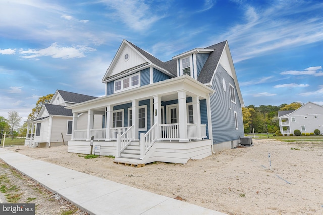 view of front of property featuring central air condition unit and covered porch