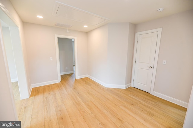 empty room with light hardwood / wood-style floors