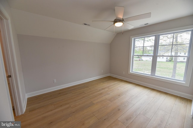 bonus room with light hardwood / wood-style floors, vaulted ceiling, and ceiling fan