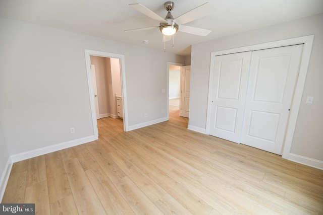 unfurnished bedroom with ceiling fan, a closet, and light wood-type flooring