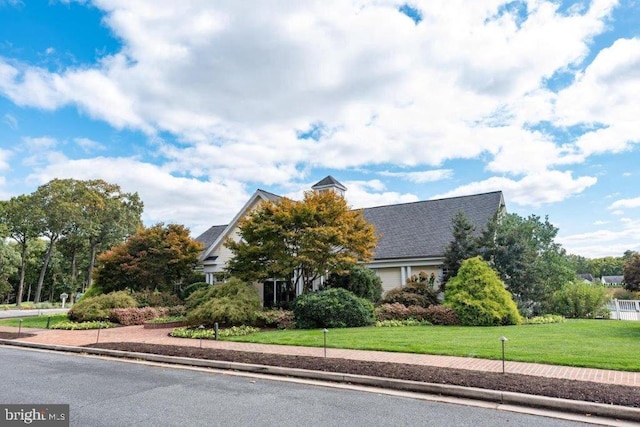 view of front of home with a front lawn