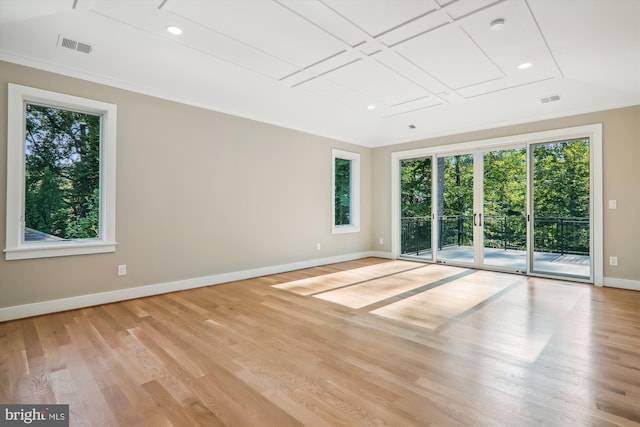 spare room with recessed lighting, wood finished floors, visible vents, and baseboards