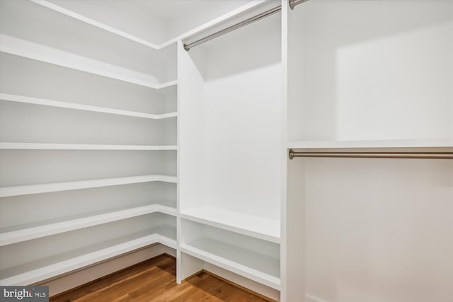 spacious closet with wood finished floors