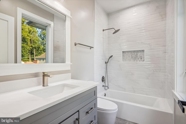 bathroom with toilet, tub / shower combination, and vanity