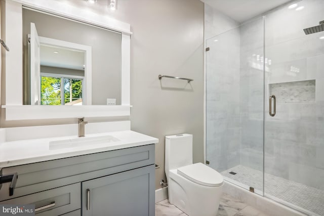 full bath featuring toilet, marble finish floor, a shower stall, and vanity