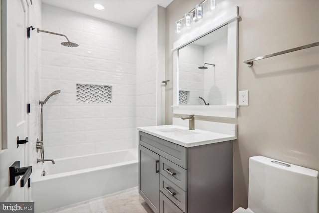 bathroom with toilet, shower / tub combination, and vanity