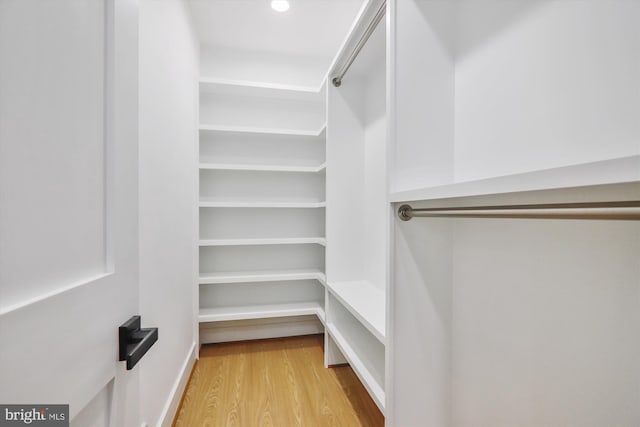 spacious closet with wood finished floors