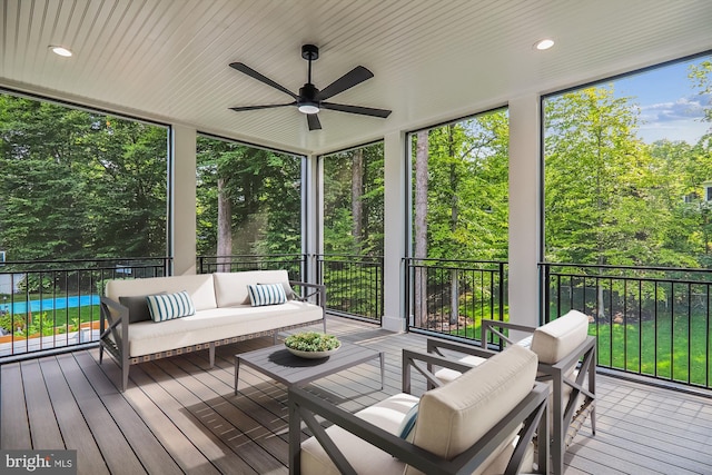 sunroom with ceiling fan