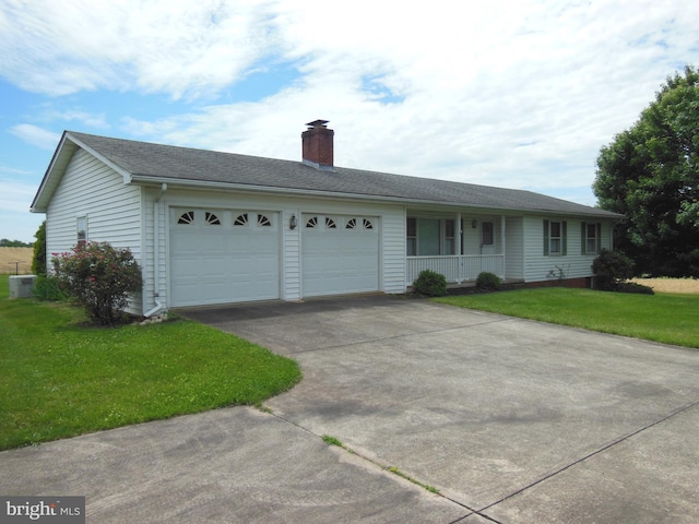 ranch-style house with cooling unit, a garage, covered porch, and a front yard