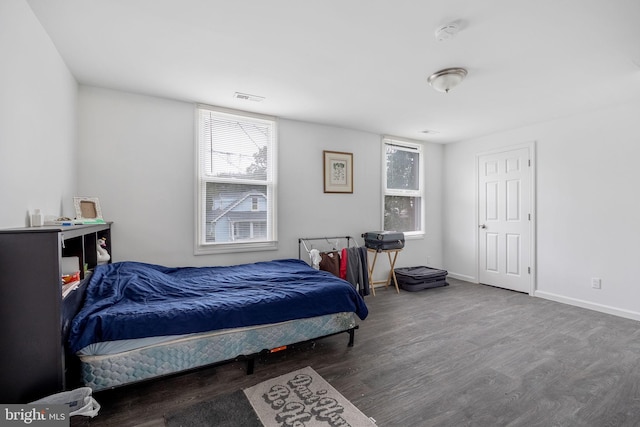 bedroom featuring dark hardwood / wood-style flooring