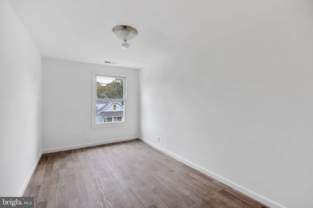 empty room with light hardwood / wood-style floors