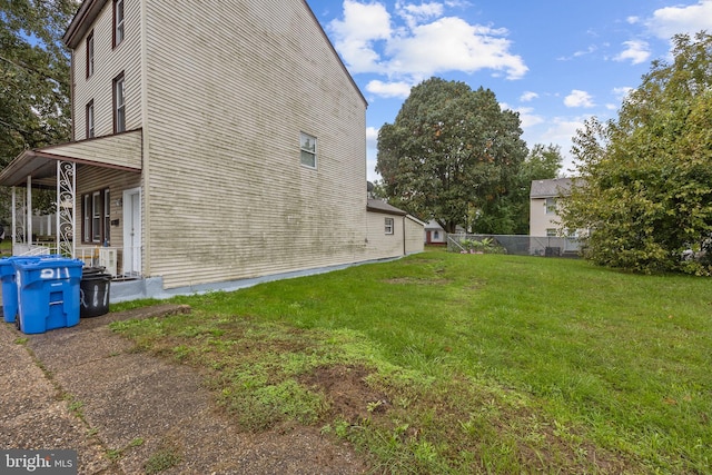 view of home's exterior with a yard