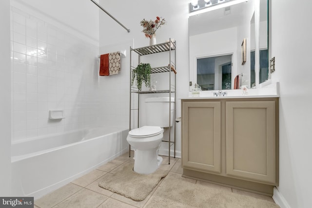 full bathroom with tile patterned floors, vanity, toilet, and tiled shower / bath