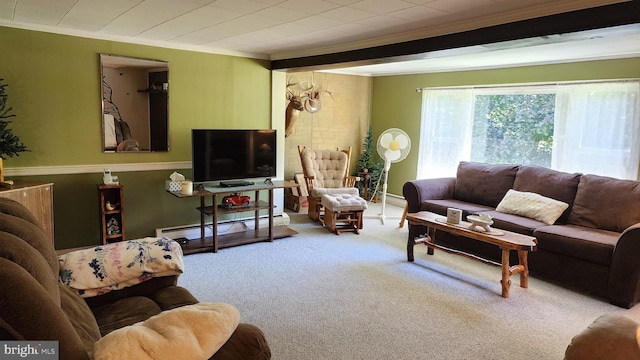 carpeted living room featuring baseboard heating and crown molding