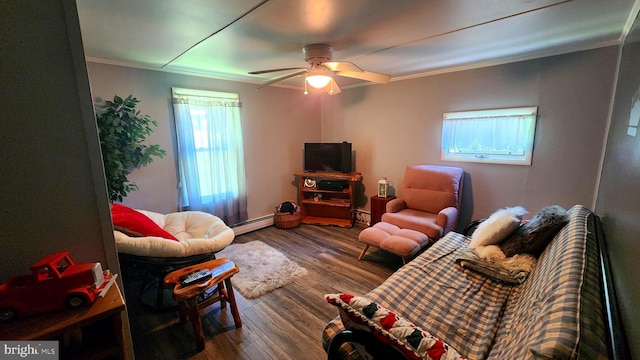 living room featuring ceiling fan, hardwood / wood-style floors, crown molding, and a baseboard radiator