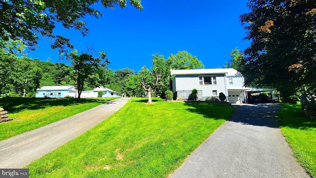 raised ranch with a carport and a front lawn