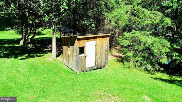 view of outdoor structure with a yard