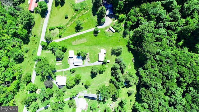 birds eye view of property with a rural view