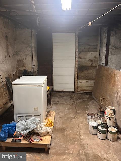 basement with fridge