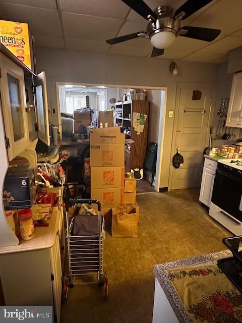 storage area featuring ceiling fan