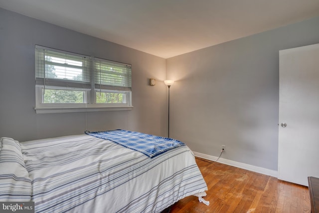 bedroom featuring hardwood / wood-style flooring