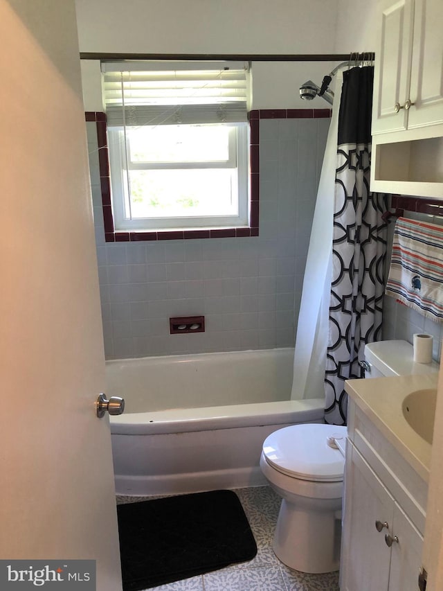 full bathroom with vanity, shower / bathtub combination with curtain, and toilet