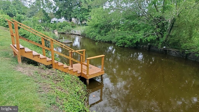 view of dock with a water view