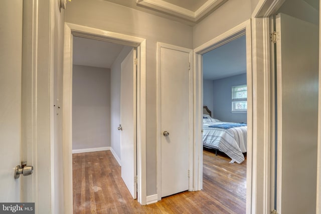 hall with wood-type flooring