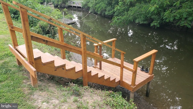 wooden deck with a water view