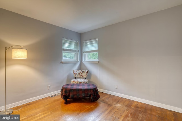 unfurnished room with hardwood / wood-style flooring