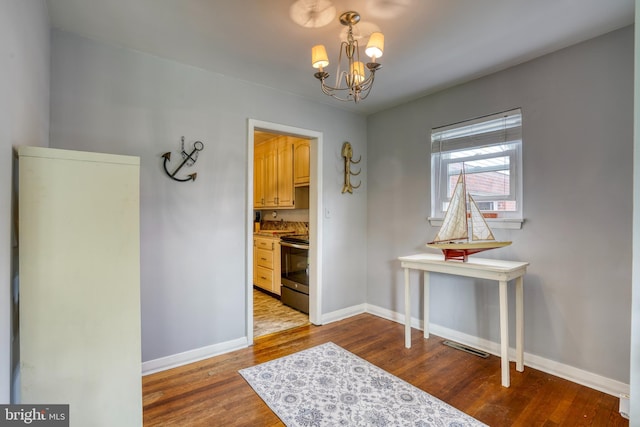 interior space featuring a chandelier and hardwood / wood-style flooring