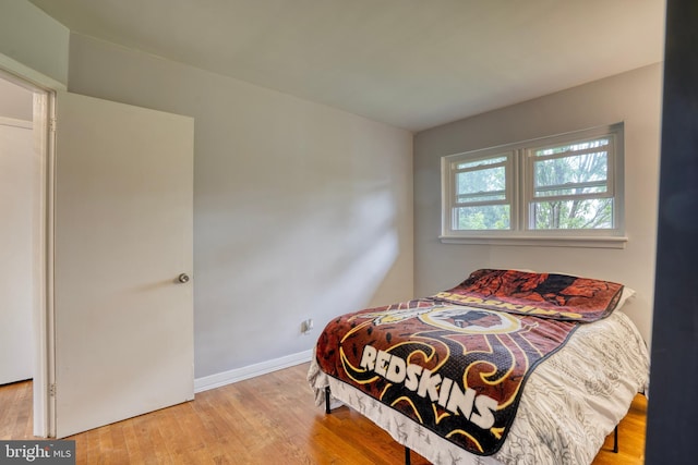 bedroom with light hardwood / wood-style flooring