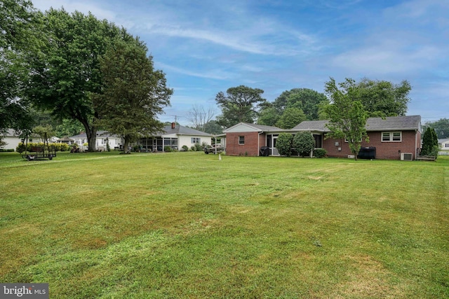 view of yard featuring central AC unit