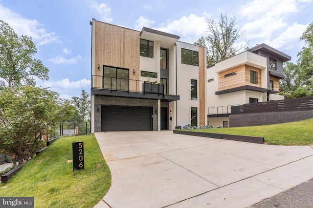 contemporary house with a front yard and a garage