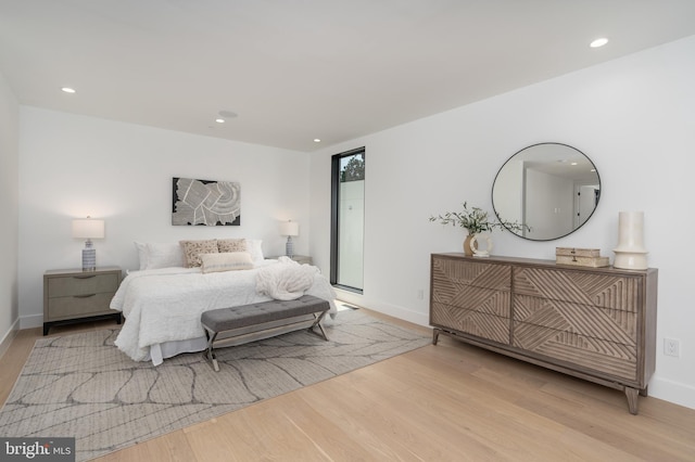 bedroom with light hardwood / wood-style floors