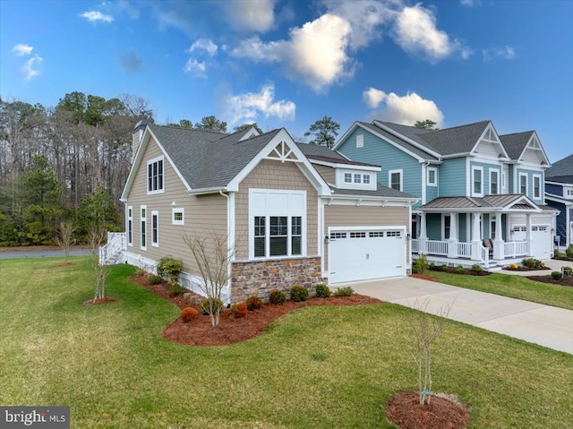 craftsman-style home featuring covered porch, a garage, and a front lawn