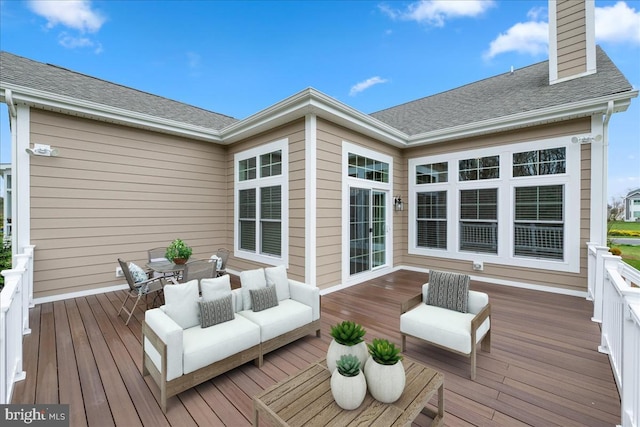 wooden terrace featuring an outdoor living space