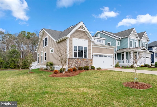 view of front of home with a garage, covered porch, and a front yard