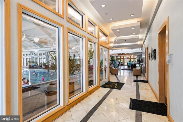 hallway with light tile patterned floors