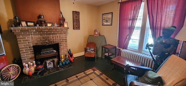 living room with a fireplace and radiator heating unit