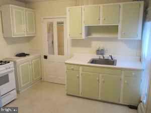 kitchen with white range oven and sink