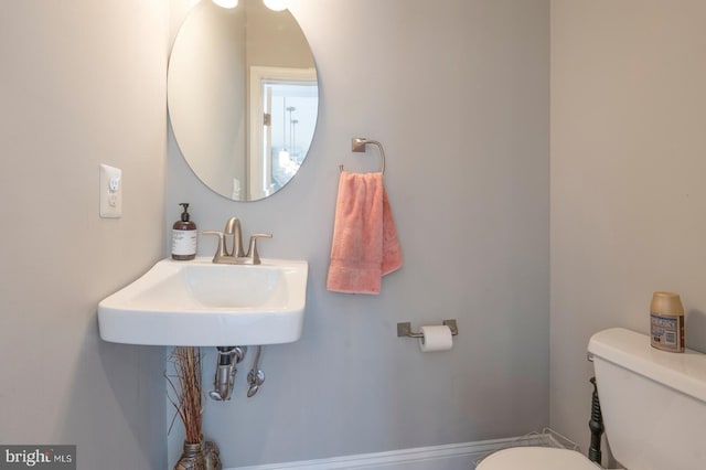 bathroom with toilet and sink