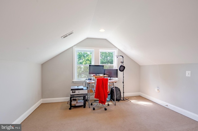 office featuring light carpet and vaulted ceiling