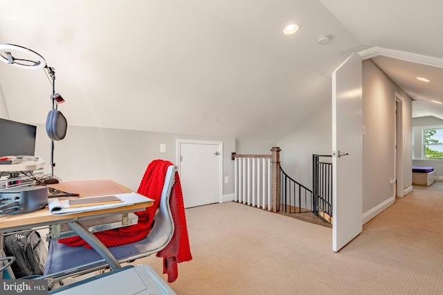 home office featuring light colored carpet and vaulted ceiling