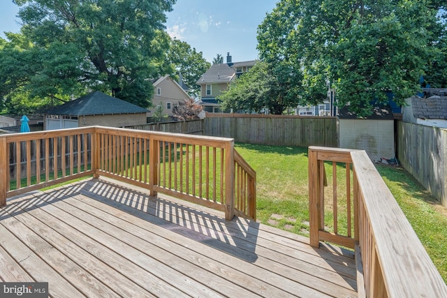 wooden deck with a lawn