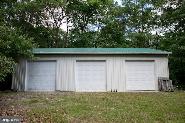 garage with a lawn