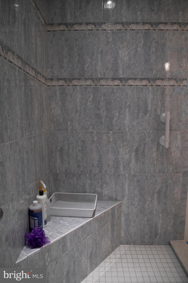 bathroom with a tile shower