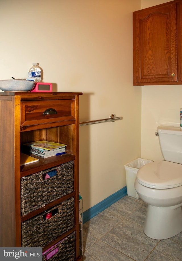 bathroom featuring tile patterned flooring and toilet