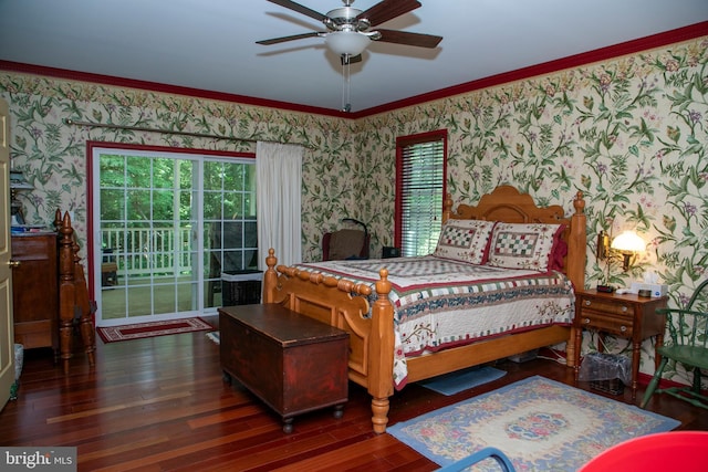 bedroom featuring dark hardwood / wood-style floors, ceiling fan, and ornamental molding