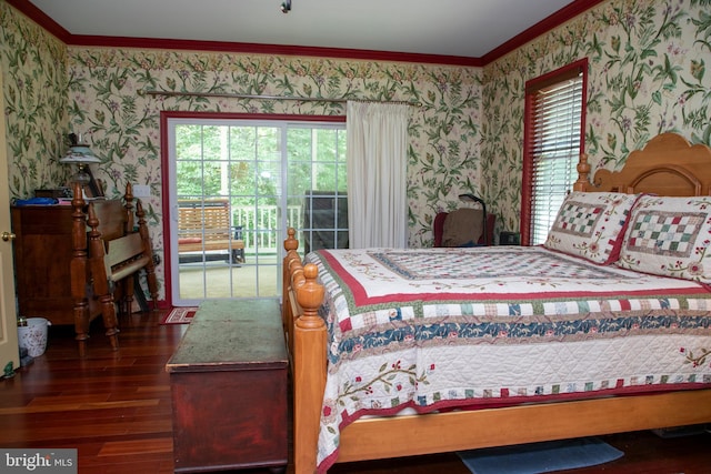 bedroom with dark hardwood / wood-style flooring, crown molding, and multiple windows